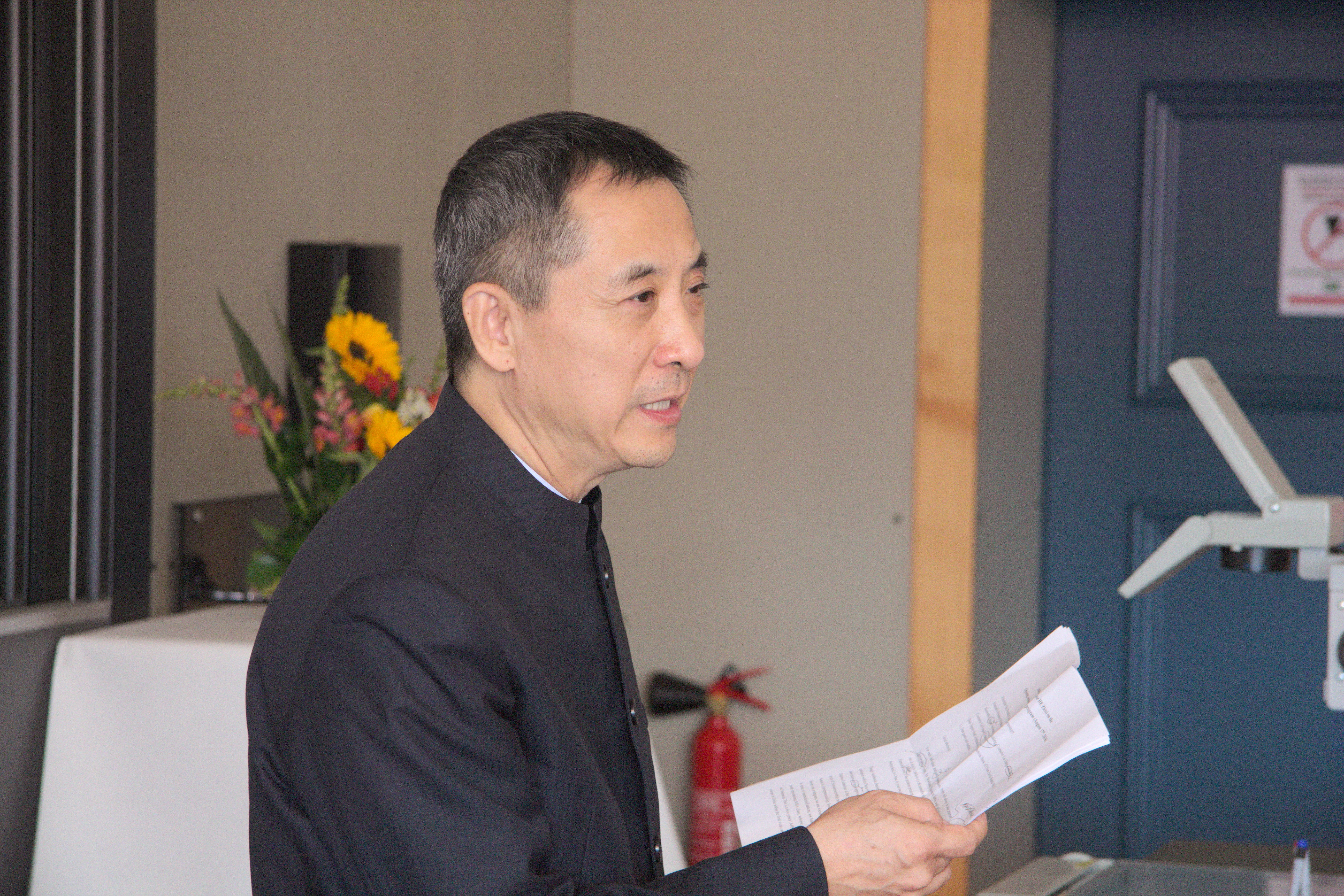 Prof. HE Zhiyi, Chairman of New Huadu Besiness School